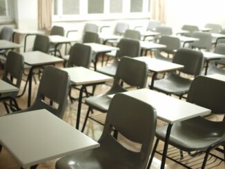 Photo of plain desks in a classroom