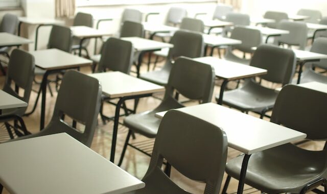 Photo of plain desks in a classroom