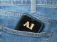 Photo of phone with AI on screen in pocket of jeans